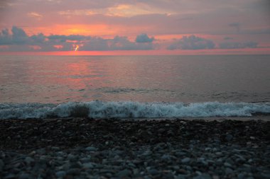 Picturesque view of sunset with clouds over sea