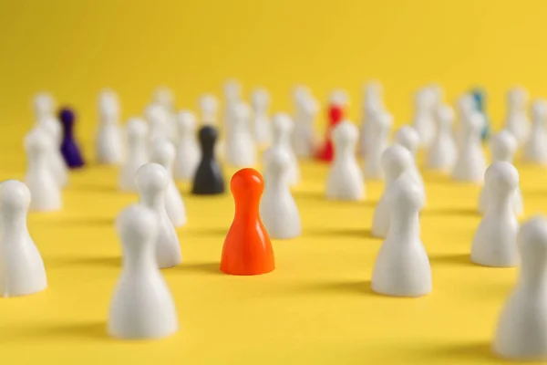 Colorful Pawns Yellow Background Closeup Social Inclusion Concept — Stock fotografie