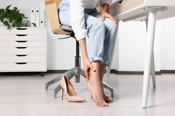 Woman Rubbing Sore Leg Office Closeup — Zdjęcie stockowe