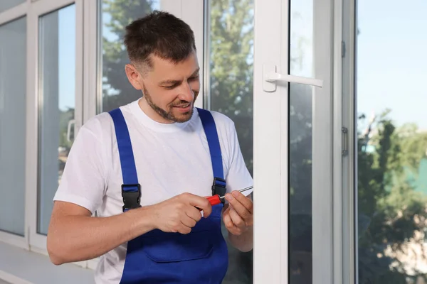 Worker Adjusting Installed Window Screwdriver Indoors — Stockfoto