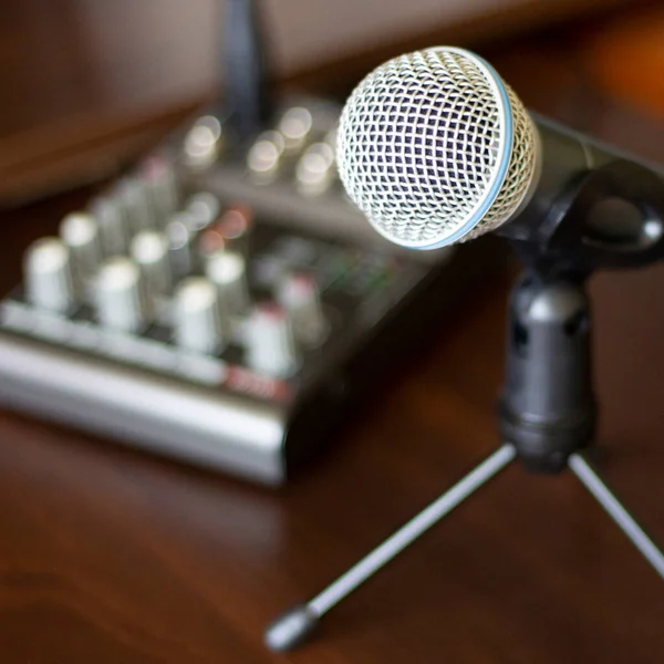 Microphone and mixer on the table. Recording studio, radio podcast. Sound audio equipment. Closeup photo