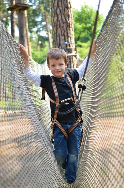 Brave little boy in adventure park — Stock Photo, Image