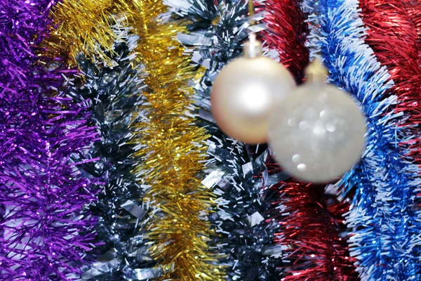 Christmas toy against the background of new year's tinsel — Stock Photo, Image