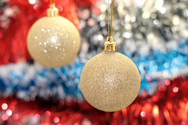 Christmas toy against the background of new year's tinsel — Stock Photo, Image