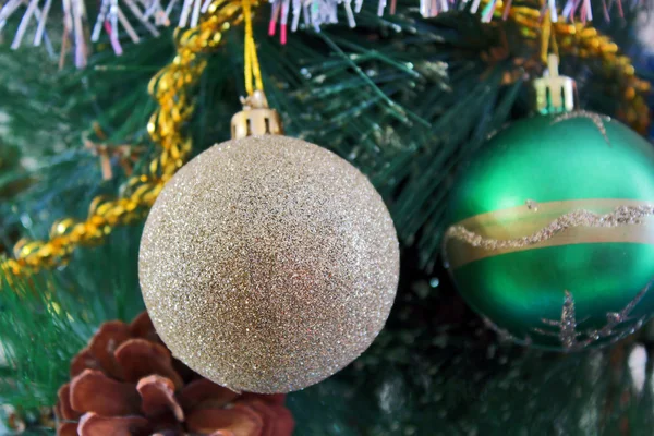 Christmas toy against the background of new year's tinsel — Stock Photo, Image