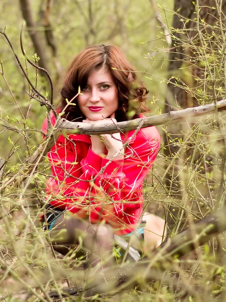 A young girl in a spring wood — Stock Photo, Image