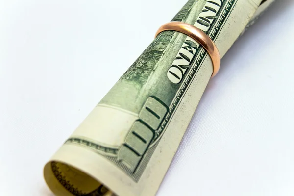 Dollar in wedding ring — Stock Photo, Image