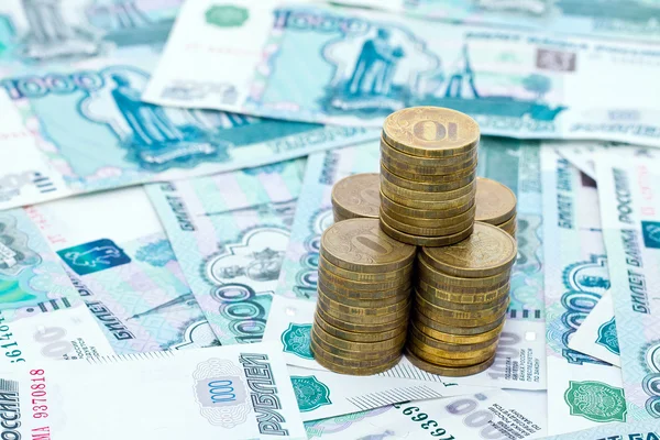 A stack of coins worth the thousandth bills — Stock Photo, Image