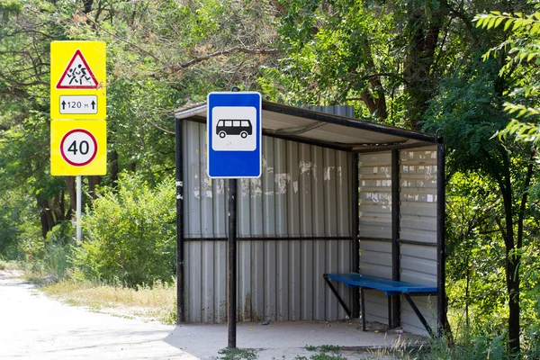 A small bus stop. Sign 