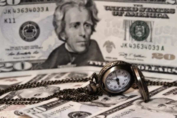 Pocket watch lie on dollars — Stock Photo, Image