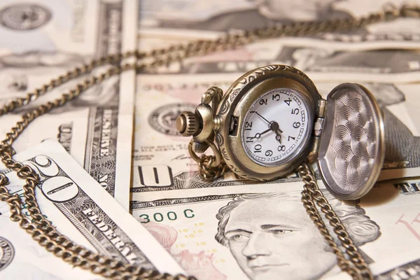 Pocket watch lie on dollars — Stock Photo, Image