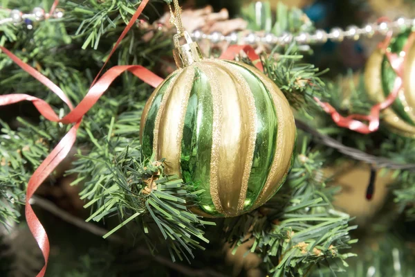 The ball is on artificial Christmas tree — Stock Photo, Image