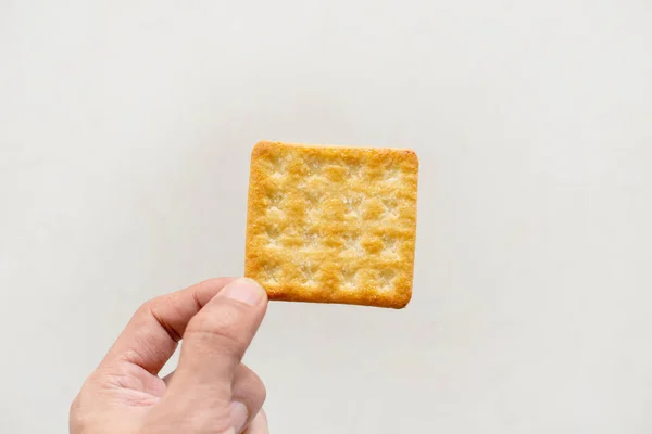 biscuits on you hand white background.
