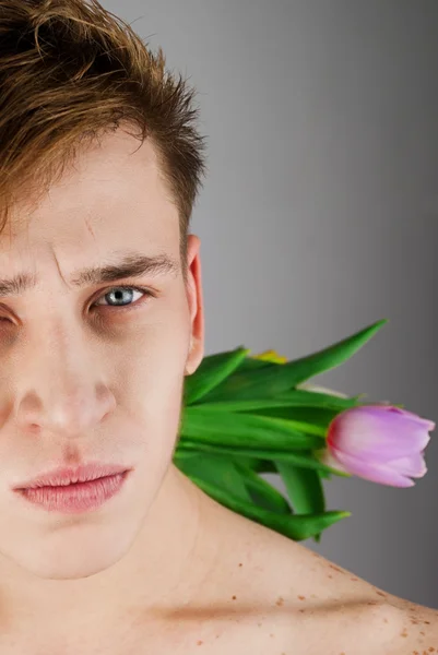 Guy with festive tulips — Stock Photo, Image