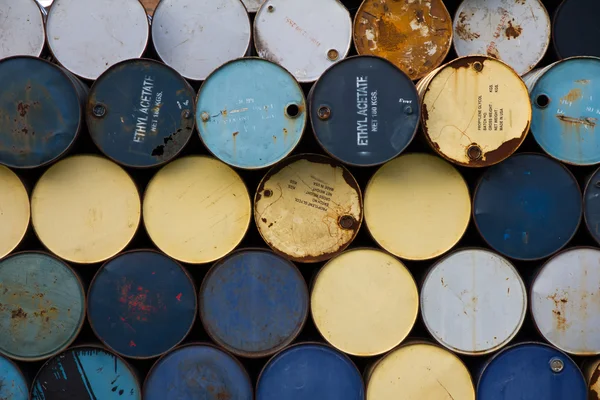 Stack of old fuel tanks background — Stock Photo, Image