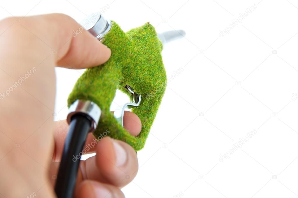 Hand holding eco fuel nozzle