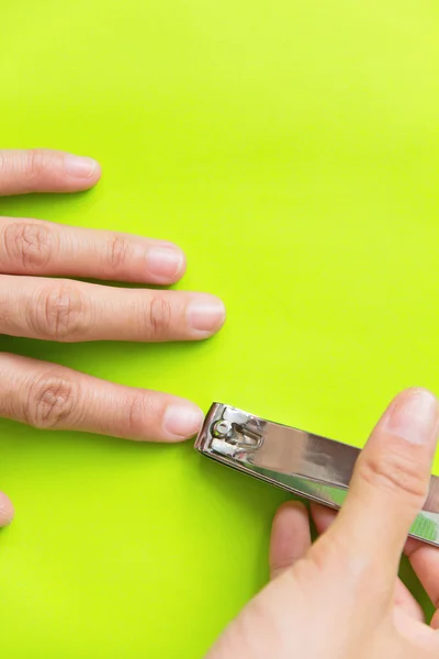 Hand manicure with nail clipper — Stock Photo, Image