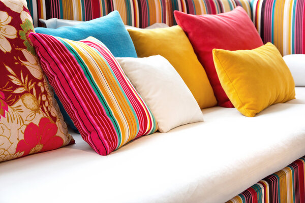 Colorful cushions in sofa.