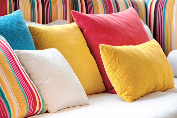 Colorful cushions in sofa.