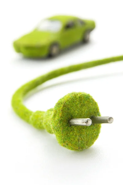 Green electric plug with eco car icon — Stock Photo, Image