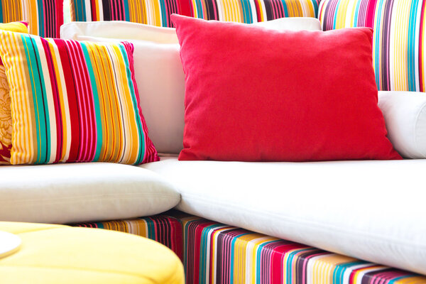 Colorful cushions in sofa.