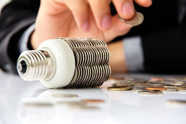 Coin light bulb — Stock Photo, Image