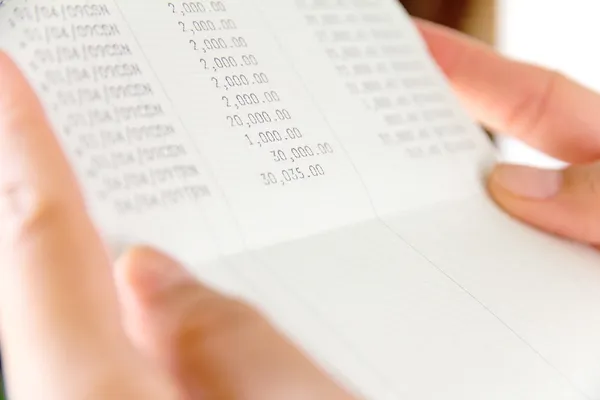 Hand holding bank account book — Stock Photo, Image