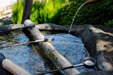 Japanese water source and ladle for the purification of hands