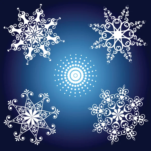 Set of white snowflakes on blue background — Stock Vector