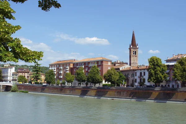 Buildings and church on quay in Verona — Stock Photo, Image