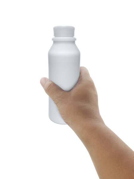 hand holding milk bottle isolated on white background