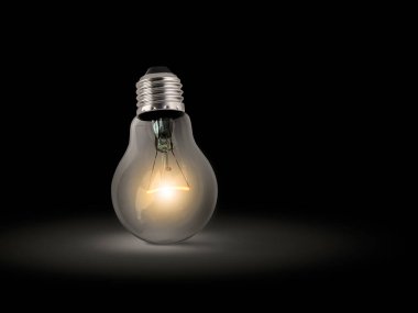 Koyu arkaplanda parlayan ampul