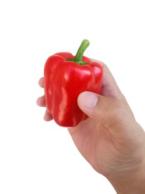 Beyaz arka plan üzerinde izole kırmızı dolmalık biber tutan el
