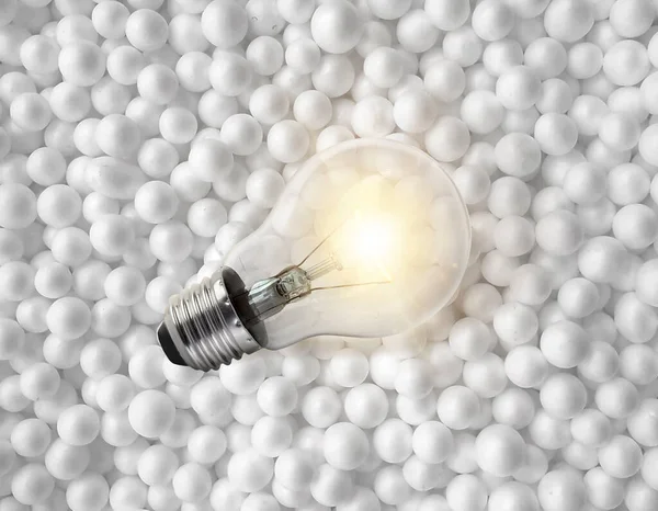 light bulbs on background of white circle styrofoam ball texture