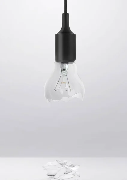 Broken bulb in room studio for advertising