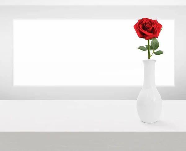 Red rose flowers in vase on white wooden table with copy space