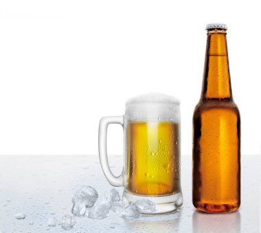 Glass and bottle of beer with water droplets and ice cubes on white background