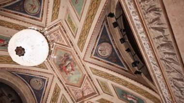Parma, Emilia-Romagna, Italy. January 2022. Amazing rotating footage of the finely decorated ceiling inside the royal theater.