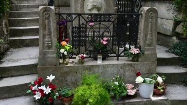 Paris, France. June 2022. At the quaint and historic Pre Lachaise cemetery, tilt footage of the grave of famous classical music composer Fryderyk Chopin