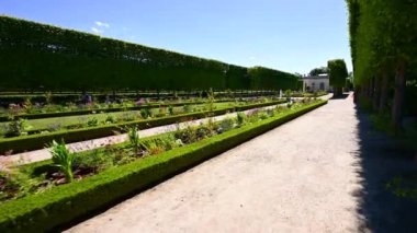 Versailles, Paris, France, June 2022. Nice pov footage walking along the gardens of the Petit Trianon. Beautiful summer day.