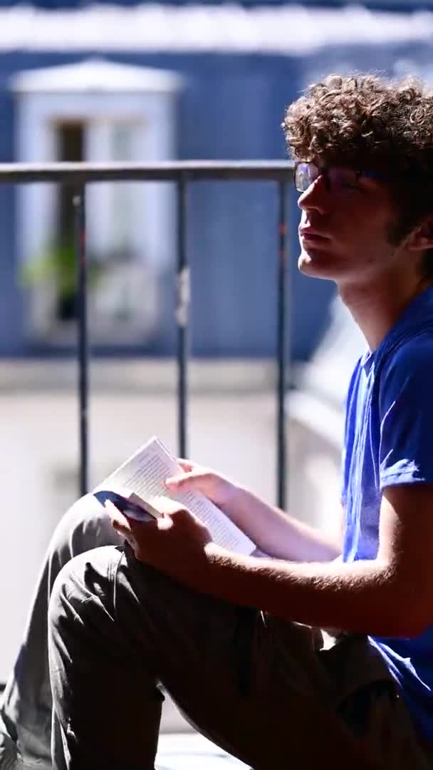 Young Caucasian Sitting Attic Window Relaxing Reading Book Blurred Background — Video