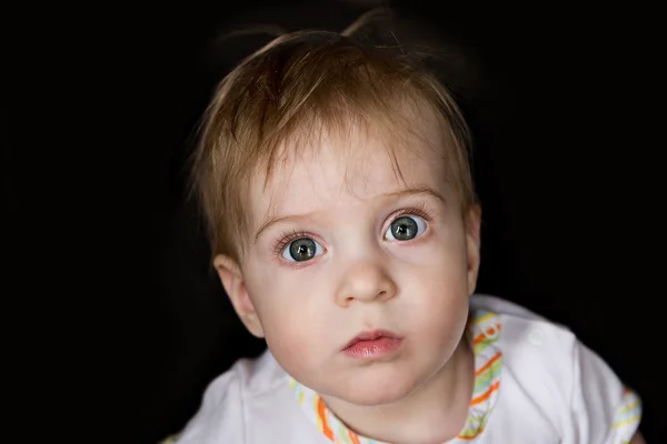 Cute child looking into the camera — Stock Photo, Image