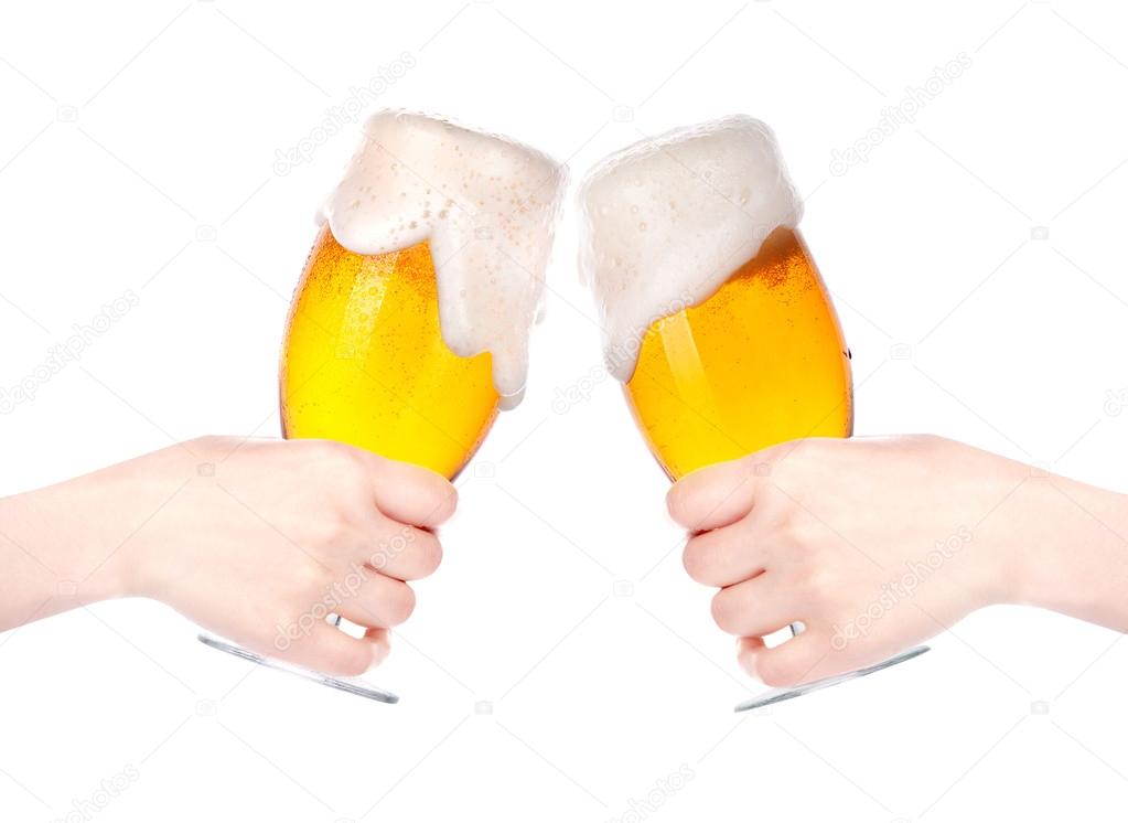 Pair of beer glasses with hand making a toast isolated