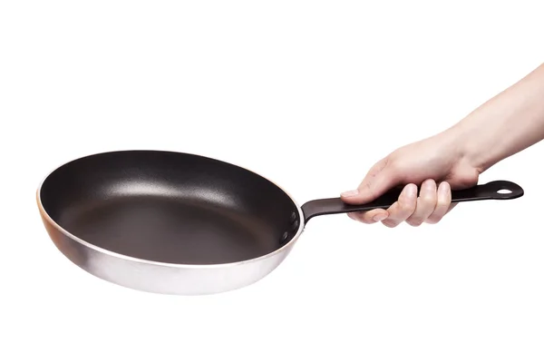 Woman's hand holding a frying pan isolated on white — Stock Photo, Image