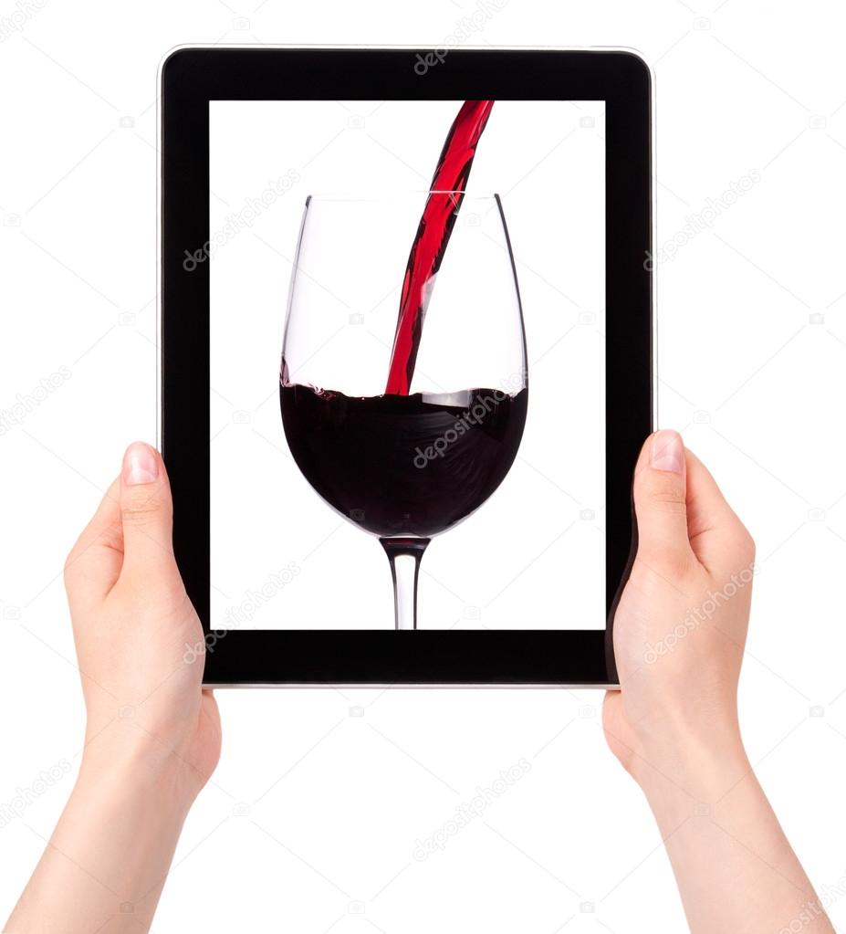 Hands Holding Digital Tablet with Red wine splashing