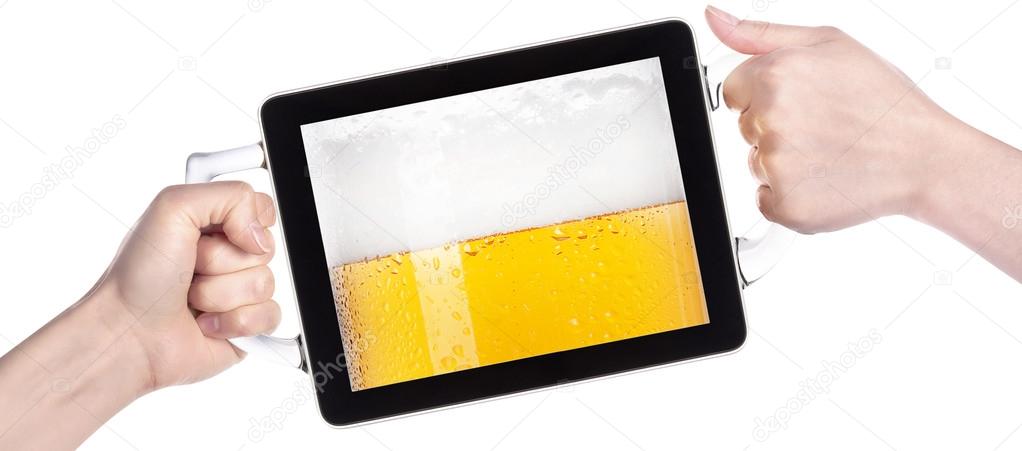 Hands holding tablet computer with beer