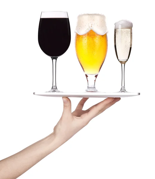 Hand holding a silver serving tray with alcohol — Stock Photo, Image