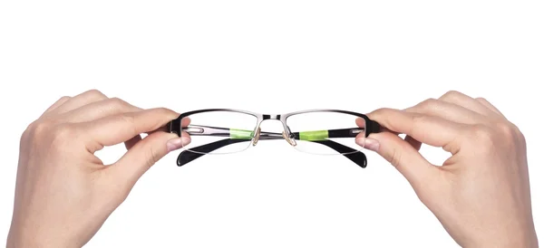 Manos sosteniendo gafas de estilo clásico — Foto de Stock