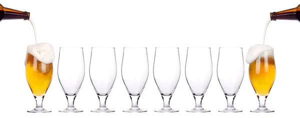 Leader concept - empty and one full beer glass — Stock Photo, Image