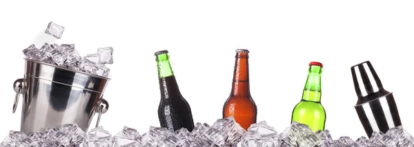Frosty beer with ice bucket and shaker — Stock Photo, Image